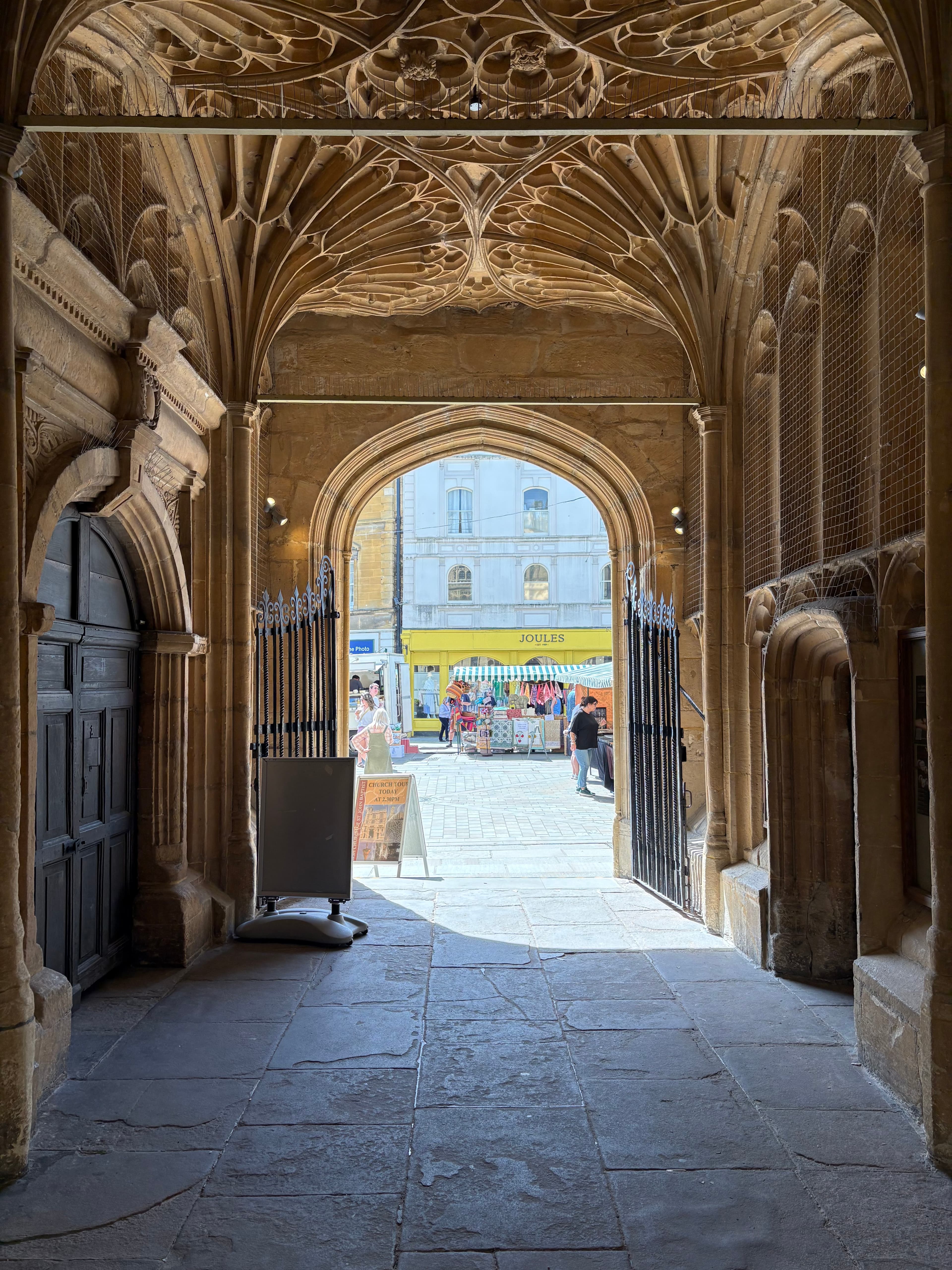 Looking up into the famous south porch — fan-vault ceiling and arched openings on to the High Street