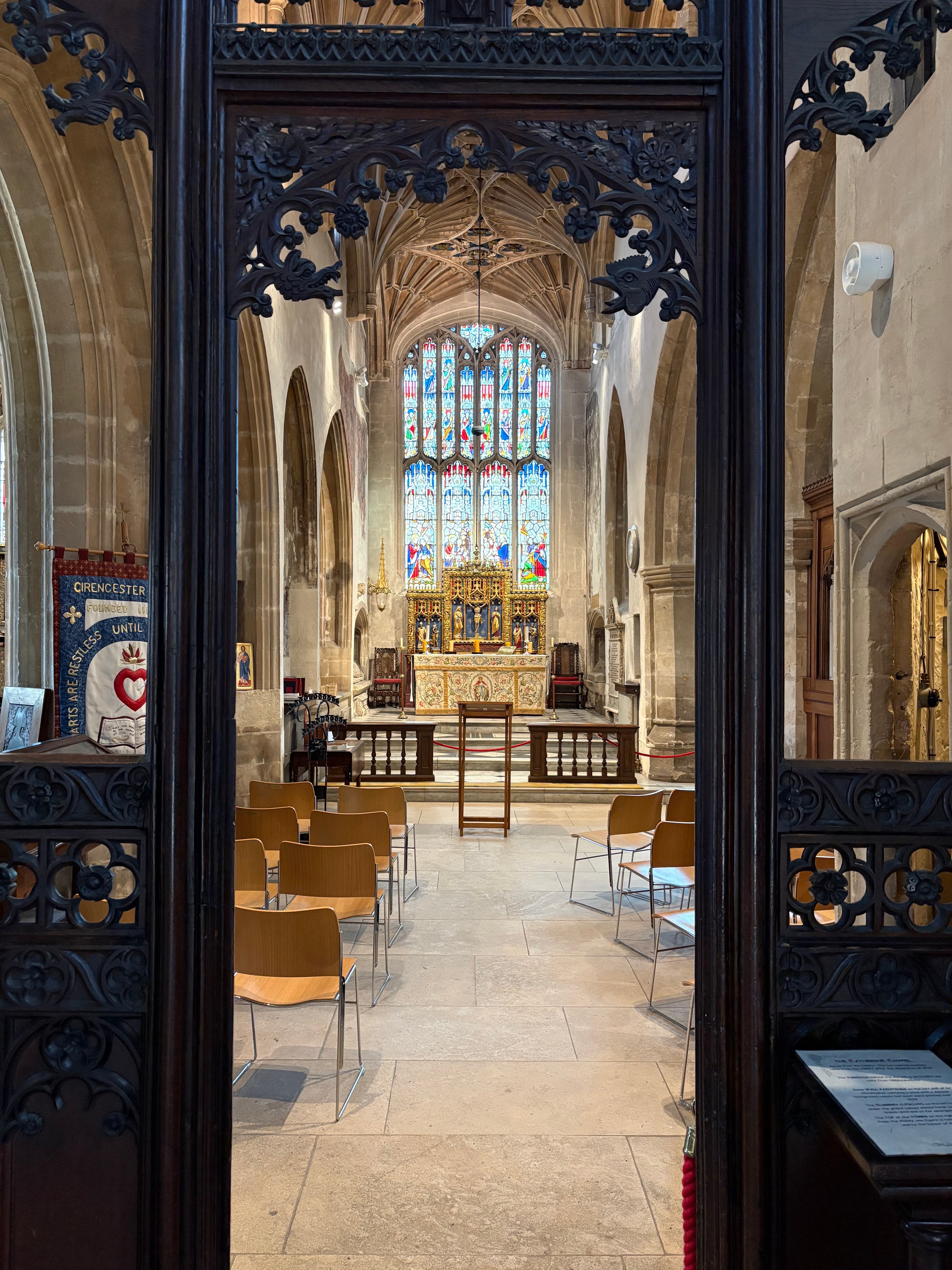 View through the carved black screen toward the east window and reredos