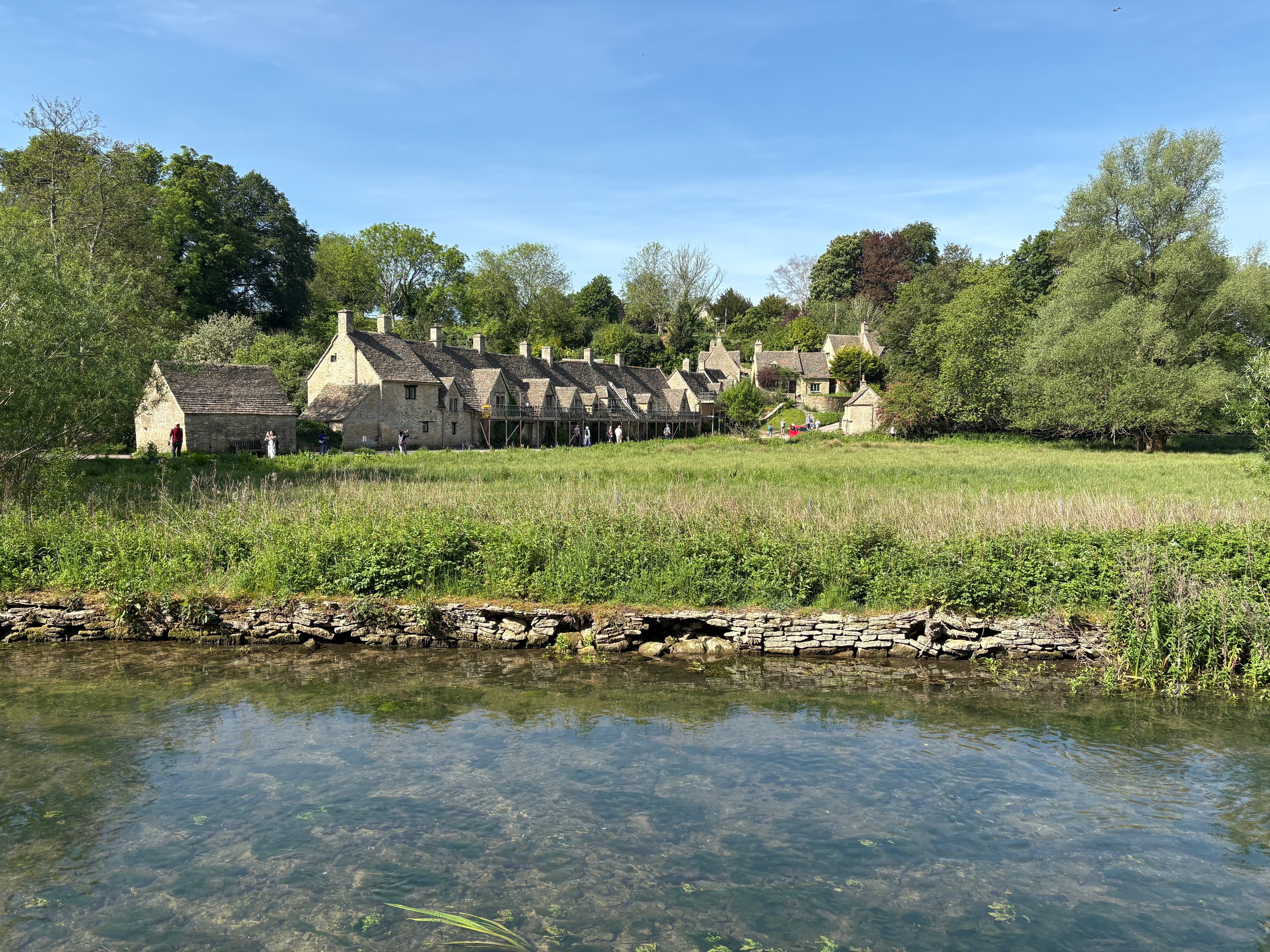 Arlington Row seen from across the Coln, with the watermeadow of Rack Isle in the foreground