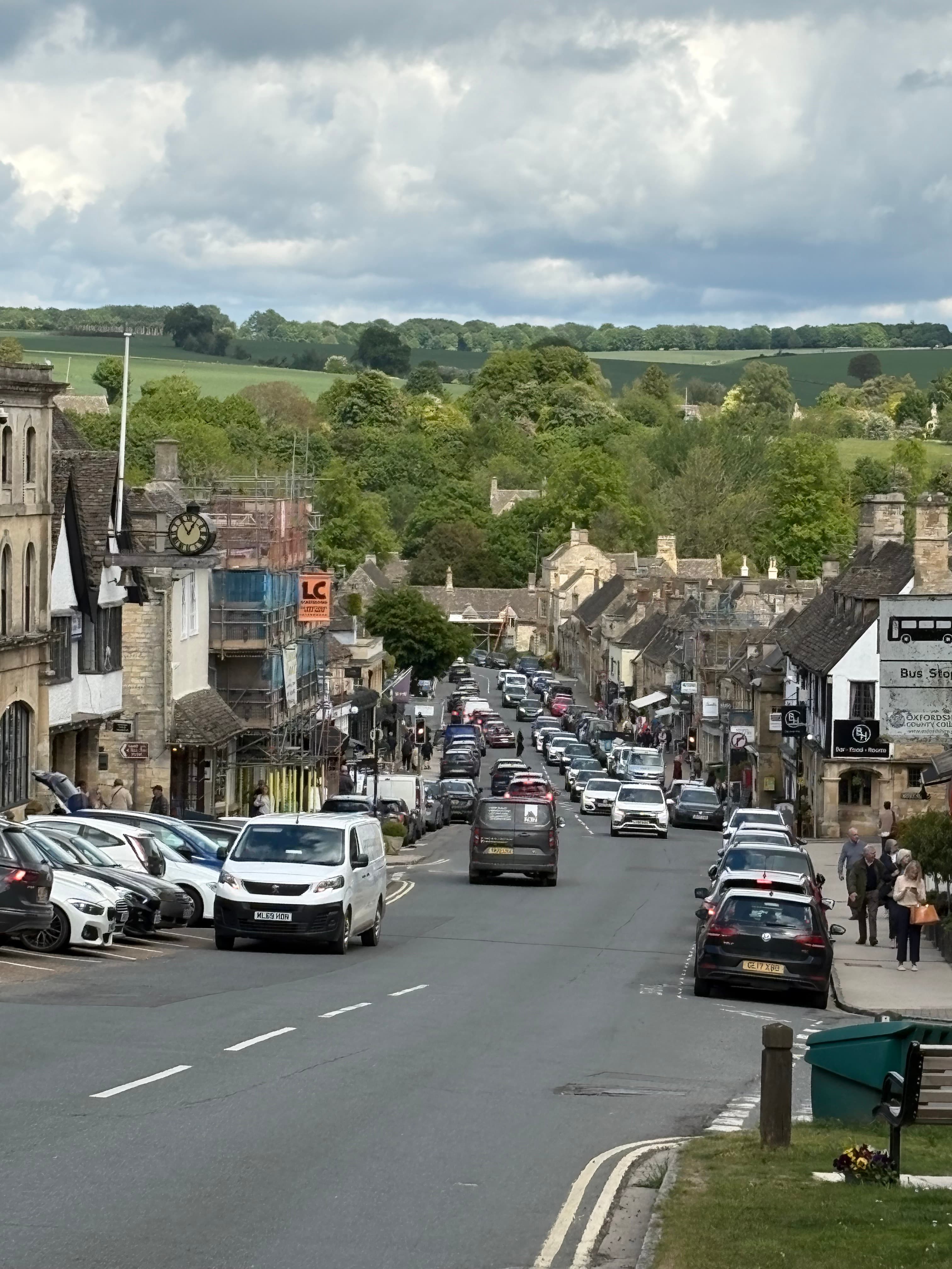 Looking down Burford's long, sloping high street toward the medieval bridge over the Windrush