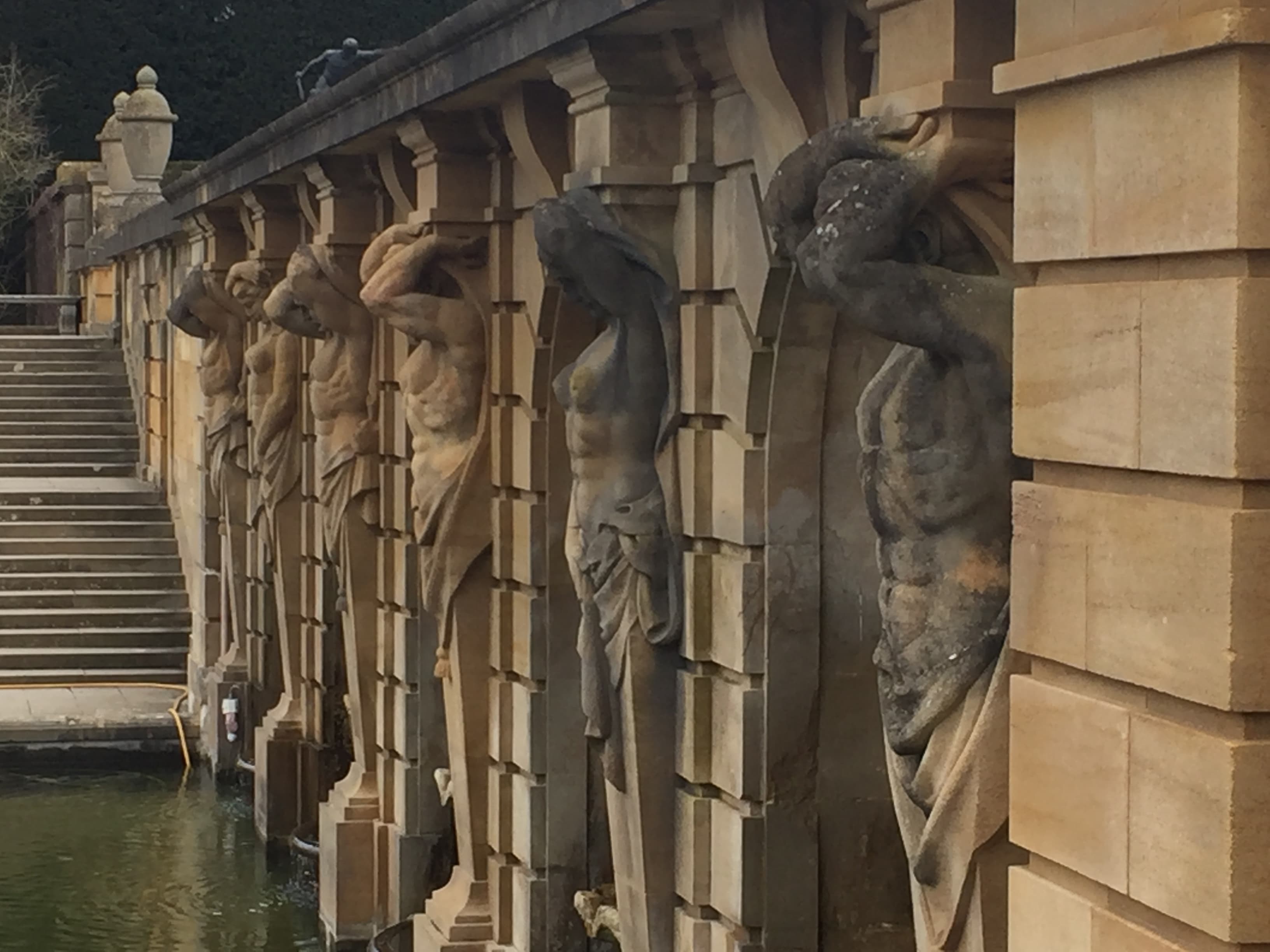 A row of stone caryatid figures along Blenheim's Lower Water Terrace, designed by Achille Duchêne in the 1920s