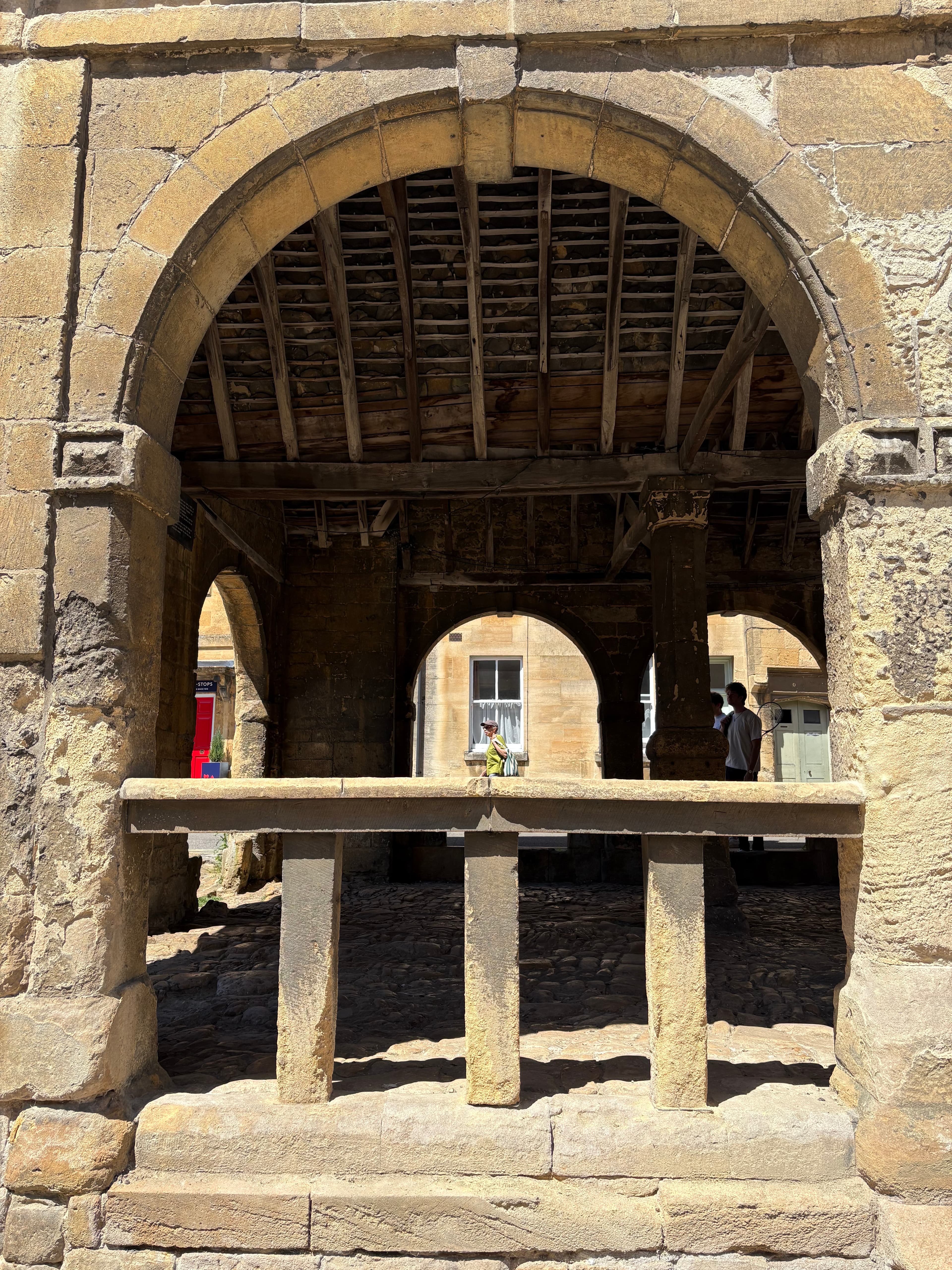Close-up of one of the Market Hall's stone arches, with the timber roof visible behind
