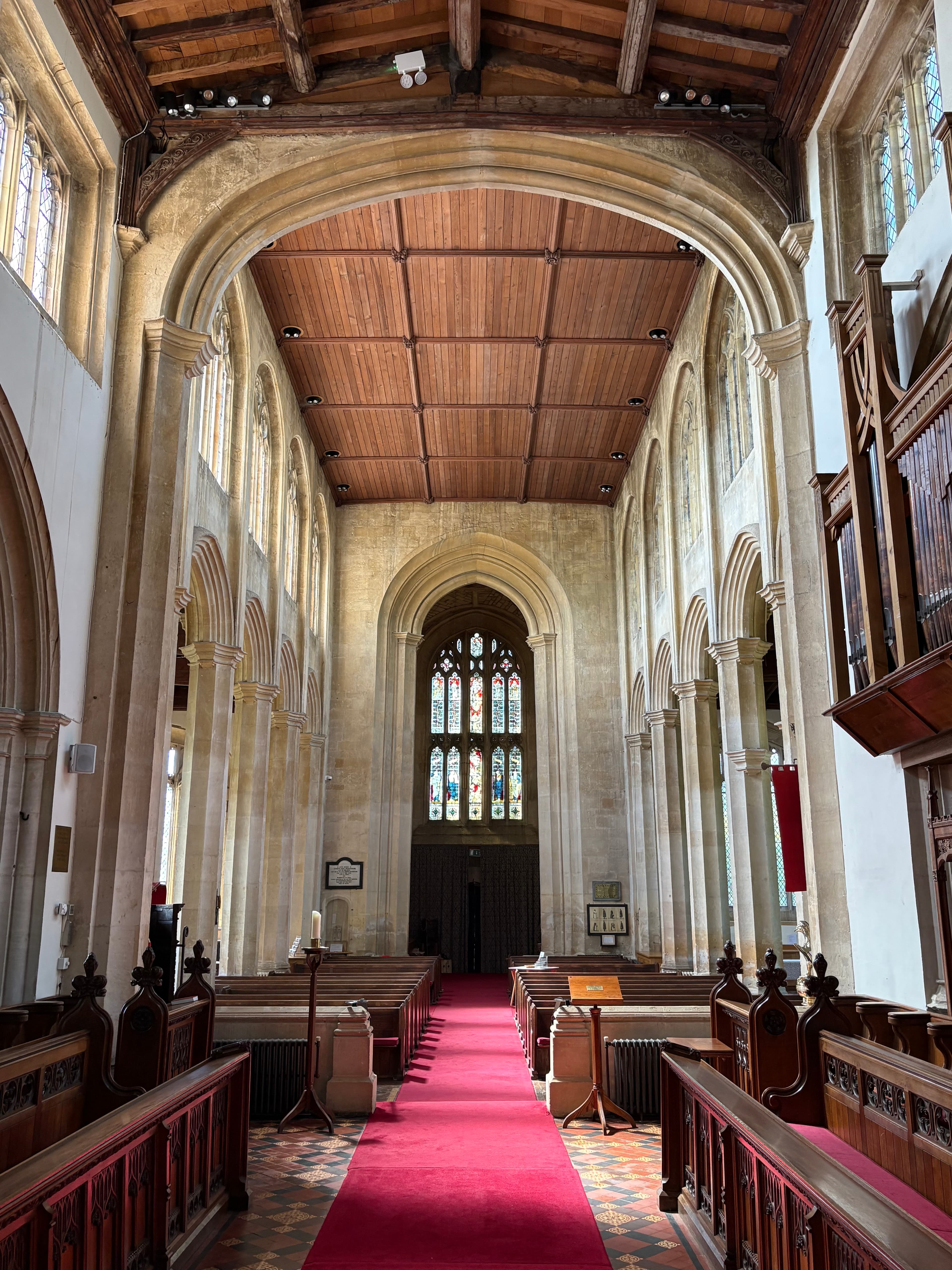 Looking down the long nave at St James's — Perpendicular arcades and a flat panelled ceiling