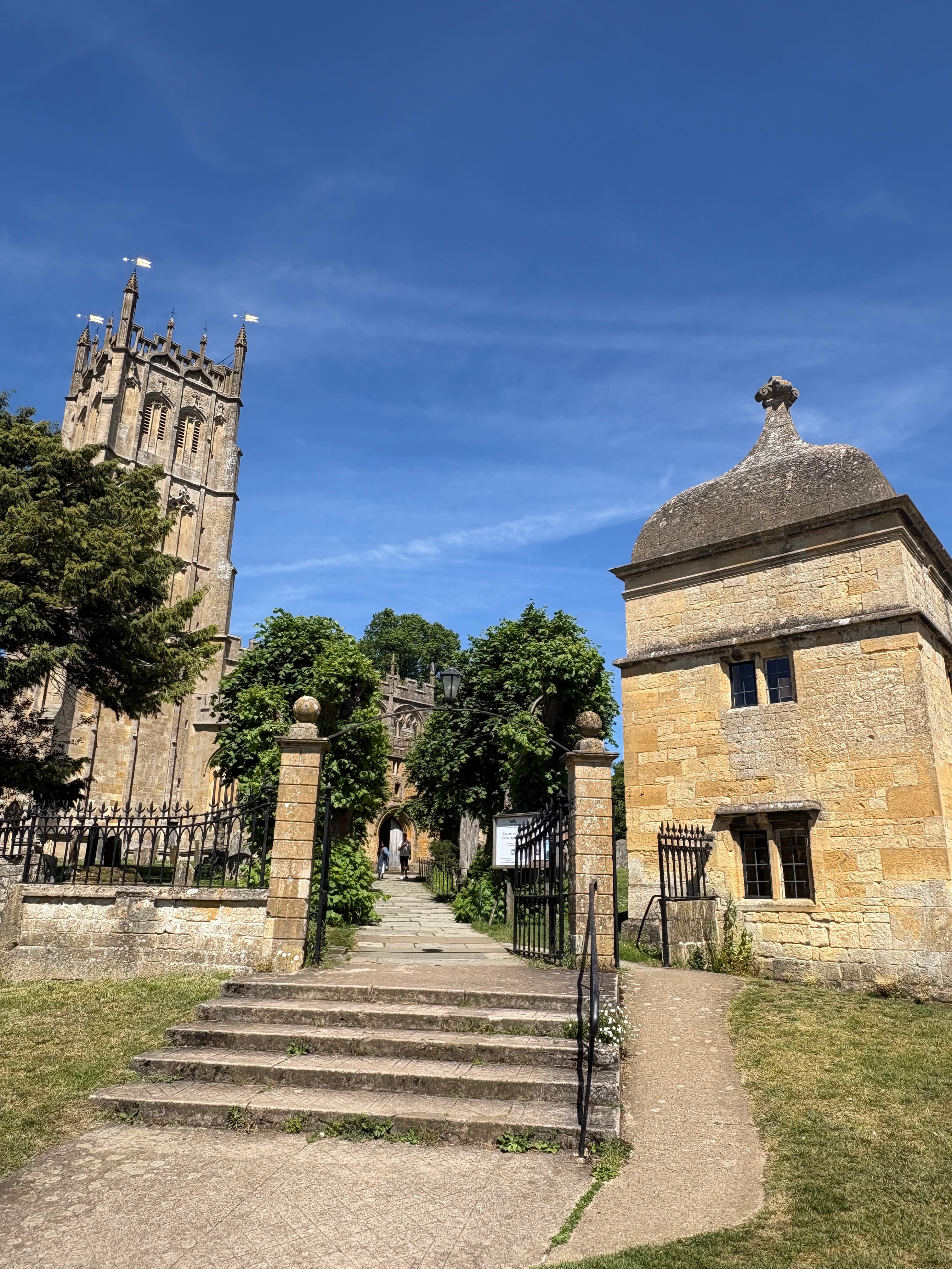 St James's Church, Chipping Campden — tower and nave seen across the churchyard from the approach path
