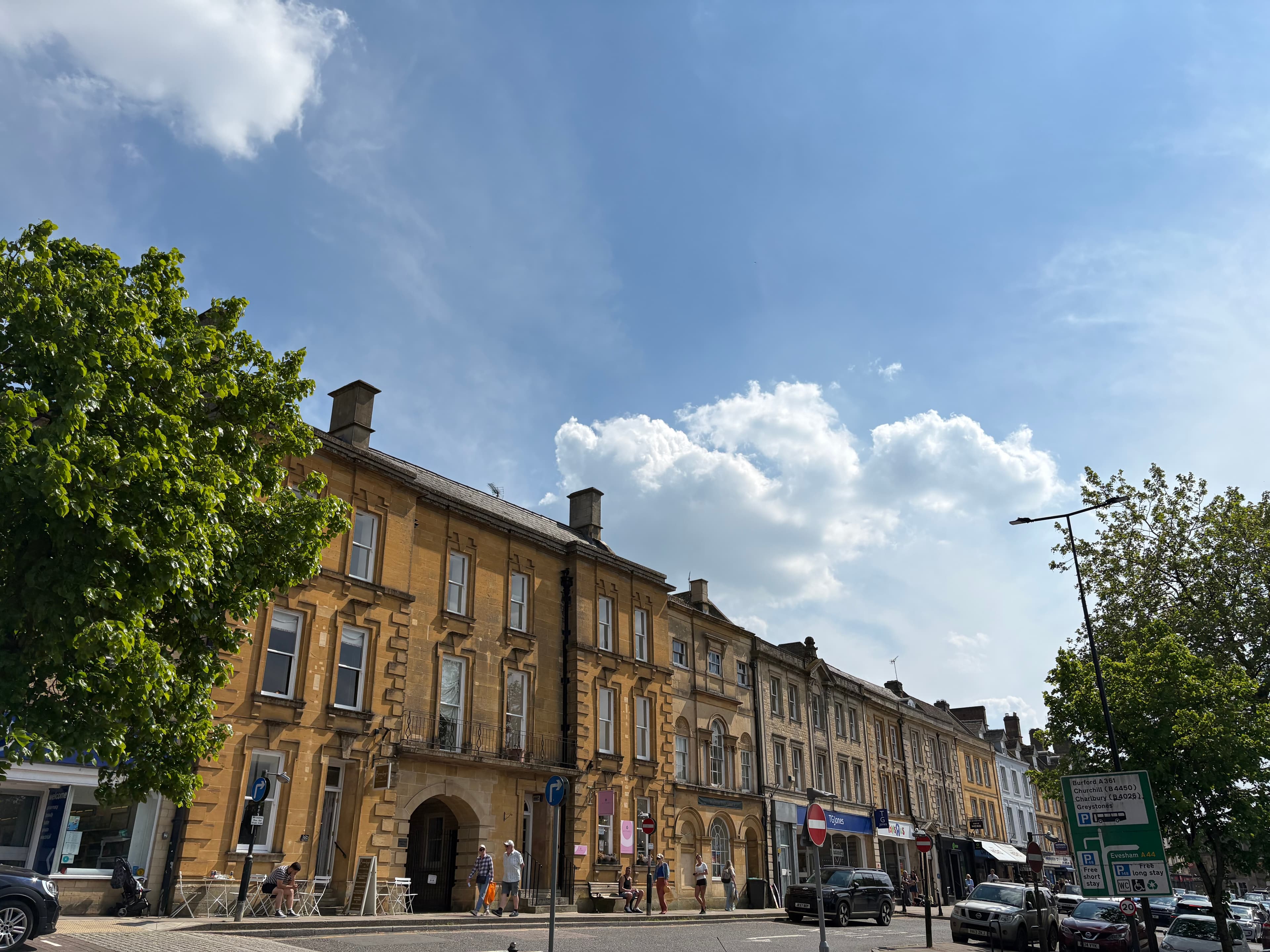 A grand ashlar-stone Victorian commercial building on the corner of Chipping Norton's Market Place