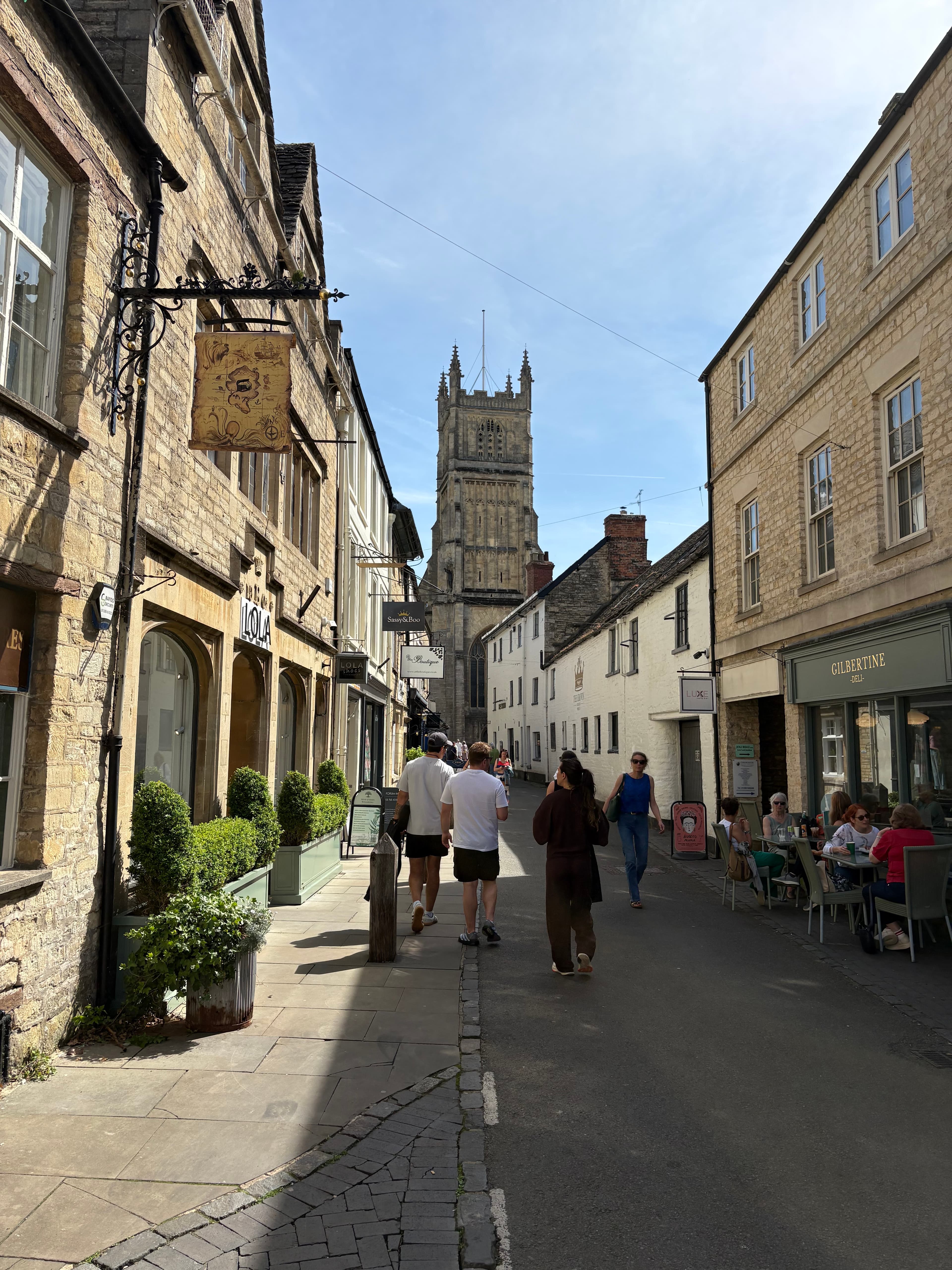 Looking up the high street toward the tower and spire of St John the Baptist Church
